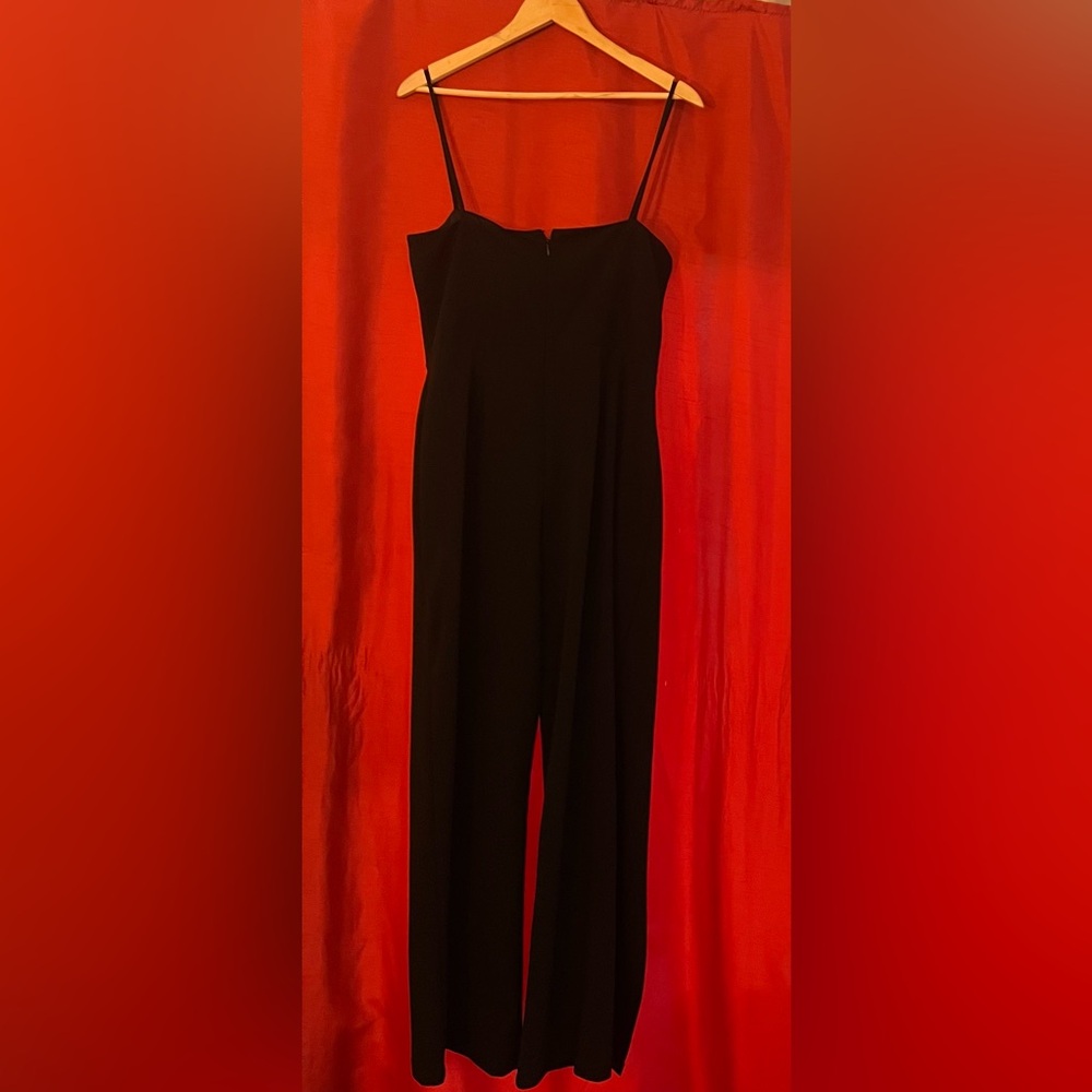 PREOWNED: Bebe Black Spaghetti Strap Jumpsuit with Front Leg Slits – Size L